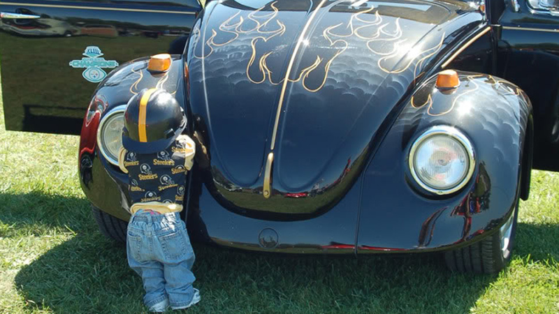 Illustration for article titled Why do car collectors put creepy dolls on their bumpers?